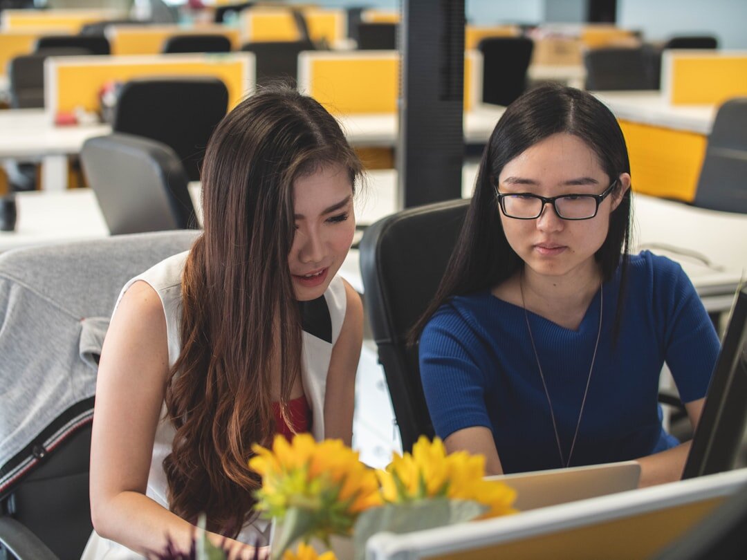 Team of analysts reviewing data charts together in an office