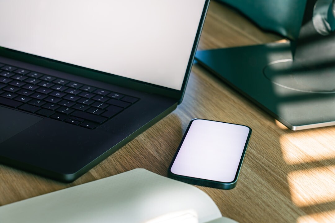 Modern technology office workspace with laptops and screens