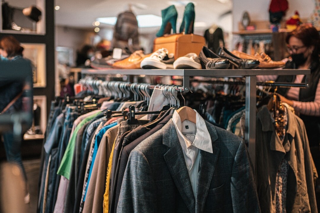 Bright modern retail store interior with clothing racks